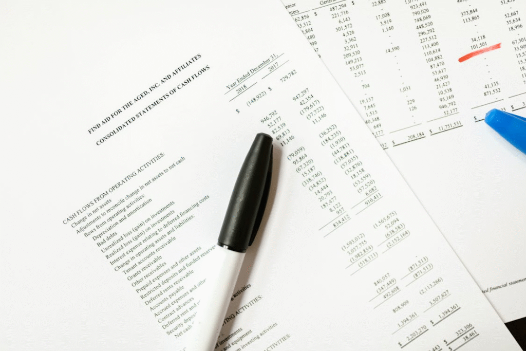 Bank statement papers stacked on each other with markers on them