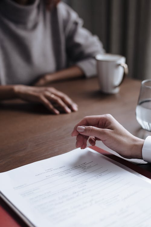 An image of a woman reviewing legal documents