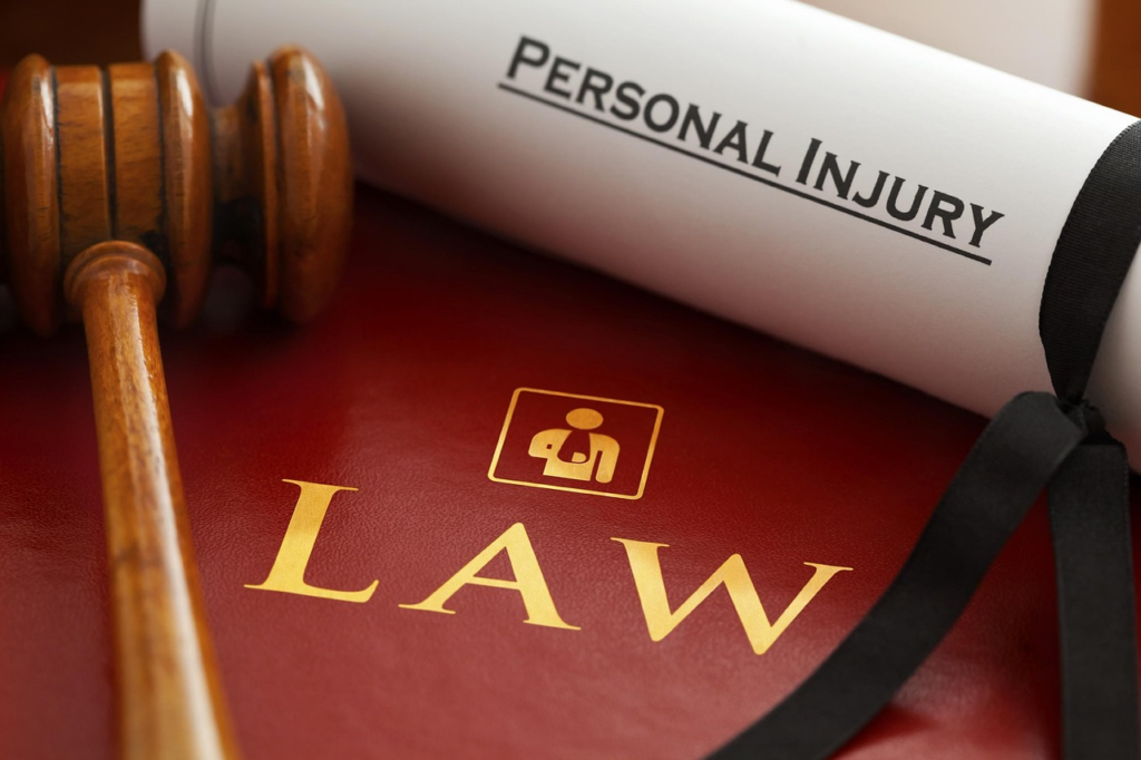 close-up of a red binder for personal injury law with a gavel on it