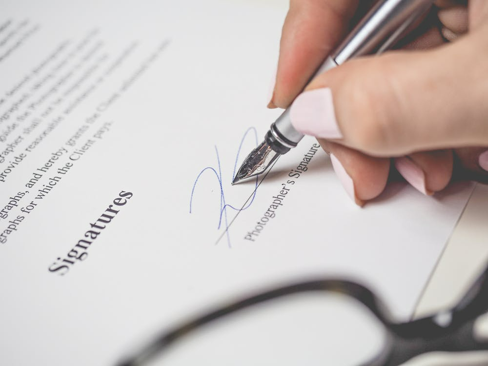 Bound revocable living trust document open to the signature page