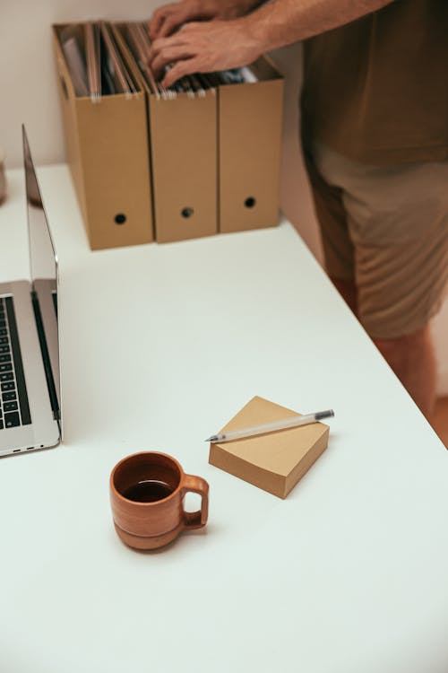 Legal binder, pen, and coffee mug arranged neatly on a professional office desk