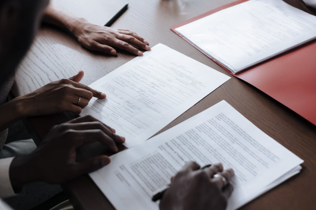 Two separate legal documents placed side by side on a clean office desk