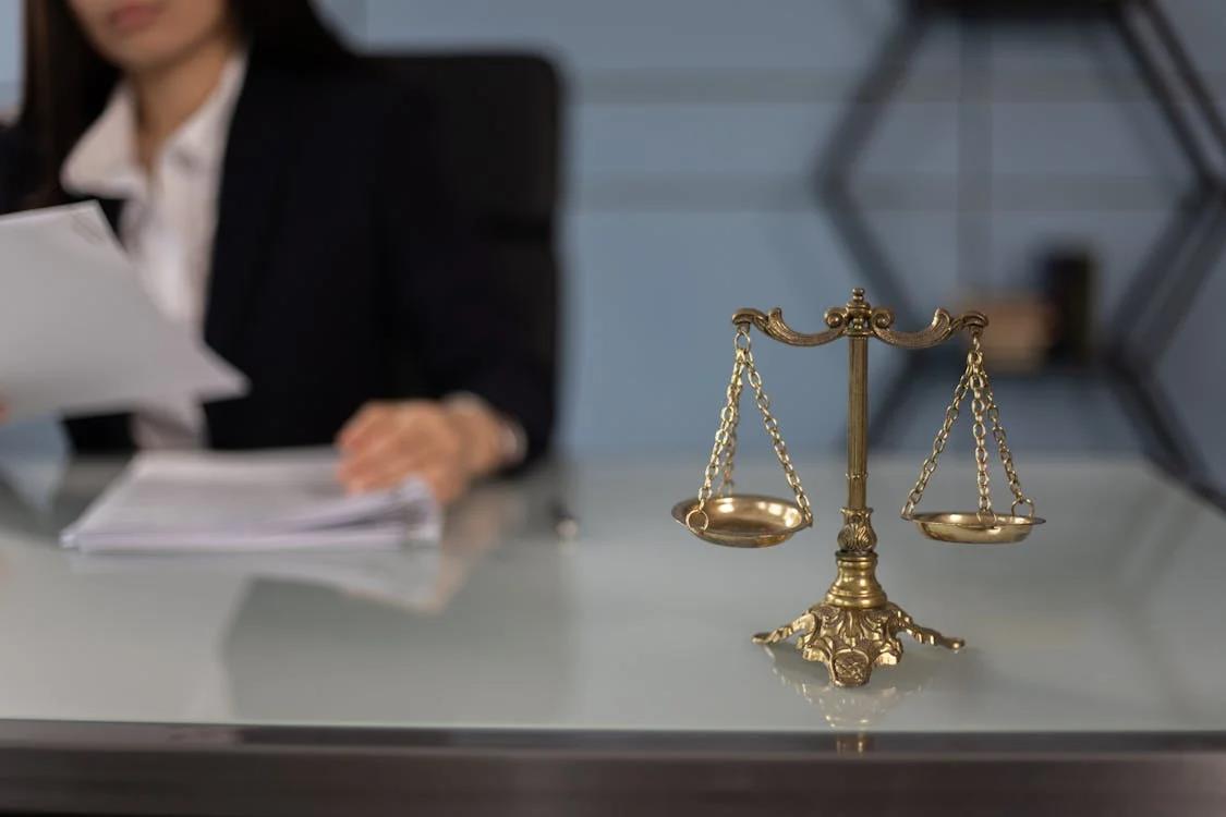 An image of a justice scale on the table