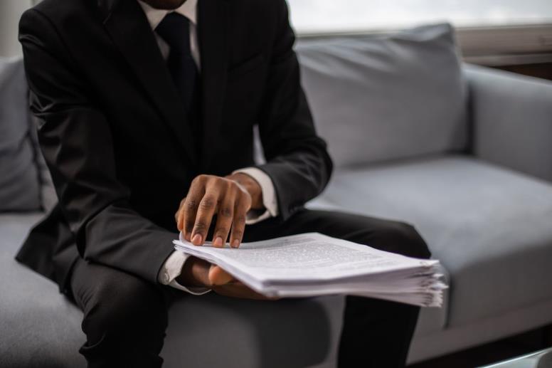 An image of a person looking through bail paperwork