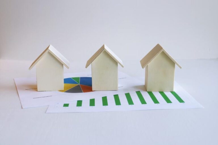 An image of three miniature wooden houses