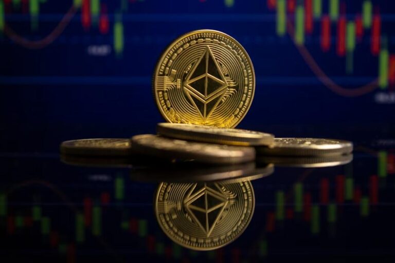 Gold Ethereum coin standing on a reflective surface with a price chart behind it